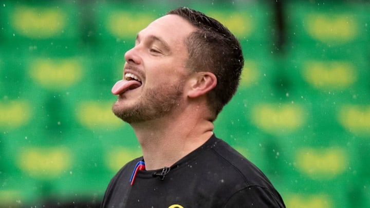 Oregon head coach Dan Lanning sticks his tongue out to catch the rain as the No. 6 Oregon Ducks host California Saturday, Nov. 4, 2023, at Autzen Stadium in Eugene, Ore.