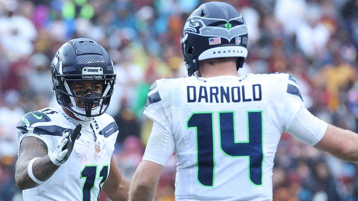 Seattle Seahawks wide receiver Jaxon Smith-Njigba (11) reacts after a catch with quarterback Sam Darnold (14).