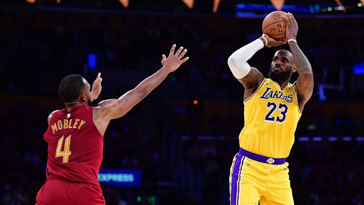 Dec 31, 2024; Los Angeles, California, USA; Los Angeles Lakers forward LeBron James (23) shoots against Cleveland Cavaliers Cleveland Cavaliers forward Evan Mobley (4) during the first half at Crypto.com Arena. Mandatory Credit: Gary A. Vasquez-Imagn Images