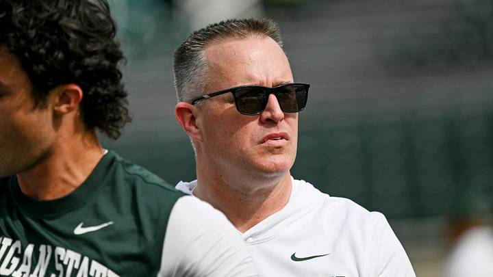 Michigan State’s head coach Pat Fitzgerald looks on as the team warms up before the game against Illinois on Saturday, Oct. 10, 2026, at Spartan Stadium in East Lansing. Michigan State’s head coach Pat Fitzgerald looks on as the team warms up before the game against Illinois on Saturday, Oct. 10, 2026, at Spartan Stadium in East Lansing.