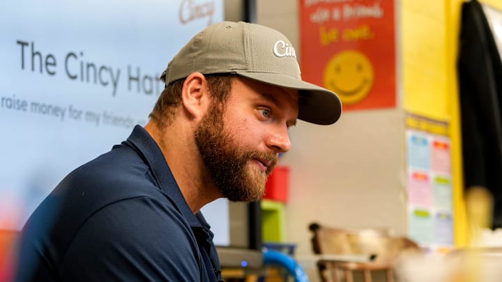 Cincinnati Bengals center Ted Karras (64) talks about his mission with The Cincy Hat to second and third grade classes on Tuesday, Nov. 28, 2023, at St. Joseph   s Consolidated School in Hamilton, Ohio. Over a year ago Karras began selling The Cincy Hat, a project that gives 100% of the proceeds from hat sales to The Village of Merici, an Indianapolis-based    living community and services provider for adults with disabilities.   