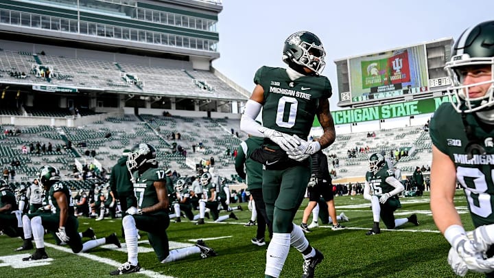Michigan State's Keon Coleman, center, and the Spartans warm up before the game against Indiana on Saturday, Nov. 19, 2022, at Spartan Stadium in East Lansing.

221119 Msu Indiana 024a