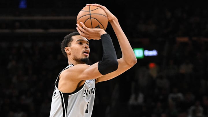 Jan 10, 2026; Boston, Massachusetts, USA; San Antonio Spurs forward Victor Wembanyama (1) attempts a shot against the Boston Celtics during the first half at the TD Garden.