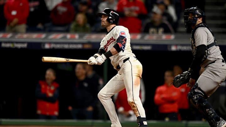 Oct 17, 2024; Cleveland, Ohio, USA; Cleveland Guardians outfielder Lane Thomas (8) doubles during the ninth inning against the New York Yankees in game 3 of the American League Championship Series at Progressive Field. Mandatory Credit: Ken Blaze-Imagn Images