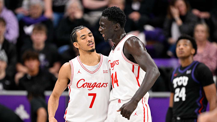 Jan 28, 2026; Fort Worth, Texas, USA; Houston Cougars guard Milos Uzan (7) and forward Kalifa Sakho (14) celebrates during the first half against the TCU Horned Frogs at Ed and Rae Schollmaier Arena. Mandatory Credit: Jerome Miron-Imagn Images