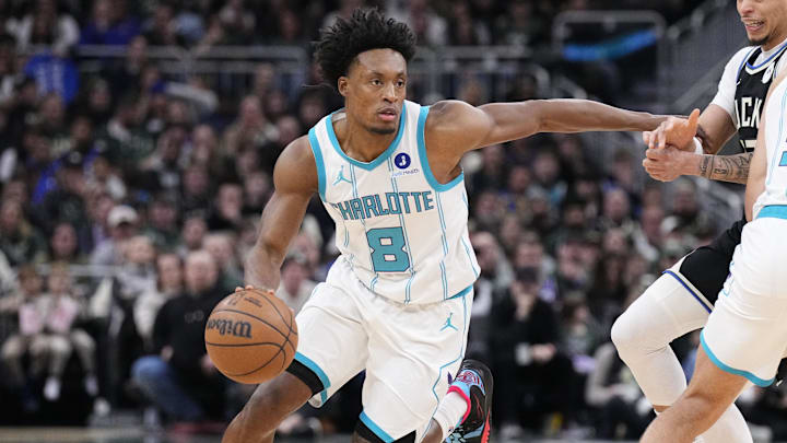 Jan 2, 2026; Milwaukee, Wisconsin, USA; Charlotte Hornets guard Collin Sexton (8) drives to the basket against Milwaukee Bucks guard Ryan Rollins (13) in the first half at Fiserv Forum. Mandatory Credit: Michael McLoone-Imagn Images