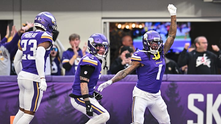 Dec 1, 2024; Minneapolis, Minnesota, USA; Minnesota Vikings cornerback Shaquill Griffin (1) and cornerback Byron Murphy Jr. (7) and cornerback Fabian Moreau (23) react after Griffin made an interception late during the fourth quarter against the Arizona Cardinals at U.S. Bank Stadium.