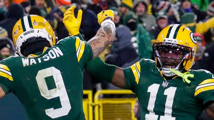Green Bay Packers receivers Christian Watson (9) and Jayden Reed celebrate after Watson scores a touchdown against the Bears.