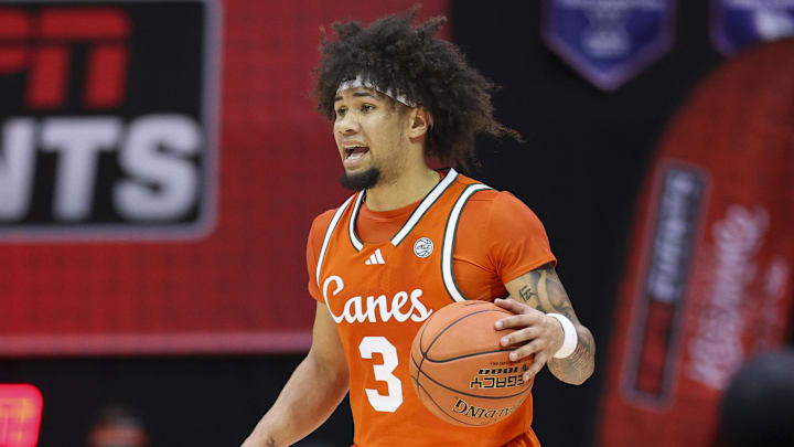 Nov 27, 2025; Kissimmee, Florida, USA; Miami (FL) Hurricanes guard Tre Donaldson (3) controls the ball against the Brigham Young University Cougars in the first half at State Farm Field House. Mandatory Credit: Nathan Ray Seebeck-Imagn Images Nov 27, 2025; Kissimmee, Florida, USA; Miami (FL) Hurricanes guard Tre Donaldson (3) controls the ball against the Brigham Young University Cougars in the first half at State Farm Field House. Mandatory Credit: Nathan Ray Seebeck-Imagn Images