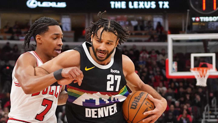 Feb 7, 2026; Chicago, Illinois, USA; Chicago Bulls guard Rob Dillingham (7) defends Denver Nuggets guard Jamal Murray (27) during the first half at United Center.
