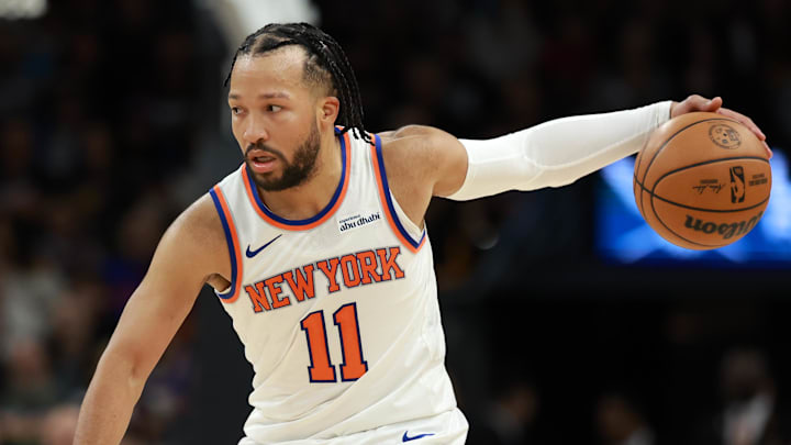 Jan 9, 2026; Phoenix, Arizona, USA; New York Knicks guard Jalen Brunson (11) controls the ball against Phoenix Suns forward Dillon Brooks (3) in the second half at Mortgage Matchup Center.