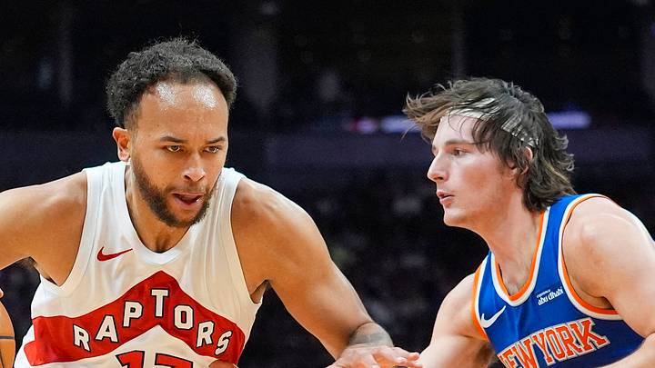 Toronto Raptors forward Kyle Anderson drives to the basket against New York Knicks guard Tyler Kolek.