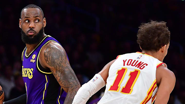 LeBron James #23 of the Los Angeles Lakers and Trae Young #11 of the Atlanta Hawks