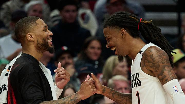 Portland Trail Blazers guard Damian Lillard, left, high fives guard Ja Morant during t a game against the Phoenix Suns. Portland Trail Blazers guard Damian Lillard, left, high fives guard Ja Morant during t a game against the Phoenix Suns.