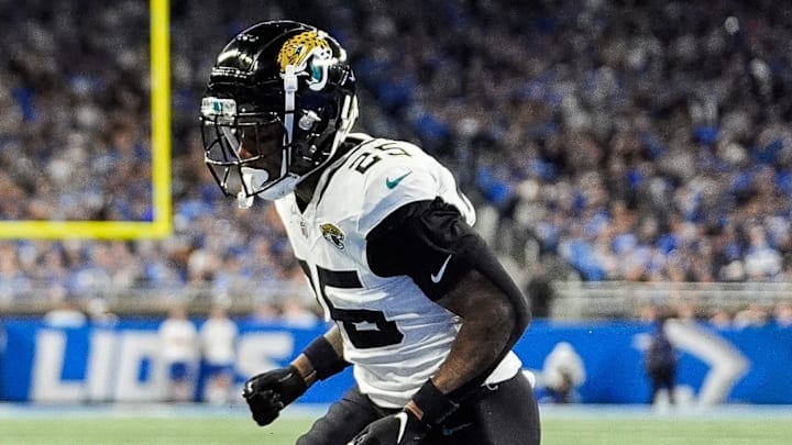 Detroit Lions wide receiver Amon-Ra St. Brown (14) makes a catch in the end zone for a touchdown against Jacksonville Jaguars cornerback Ronald Darby (25) during the second half at Ford Field in Detroit on Sunday, Nov. 17, 2024.