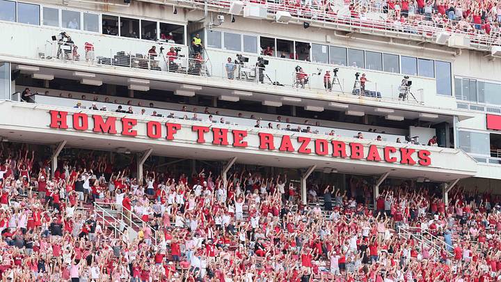 Arkansas Razorbacks fans cheer after a score against the Alabama A&M Bulldogs during the third quarter at Razorback Stadium. Arkansas Razorbacks fans cheer after a score against the Alabama A&M Bulldogs during the third quarter at Razorback Stadium.