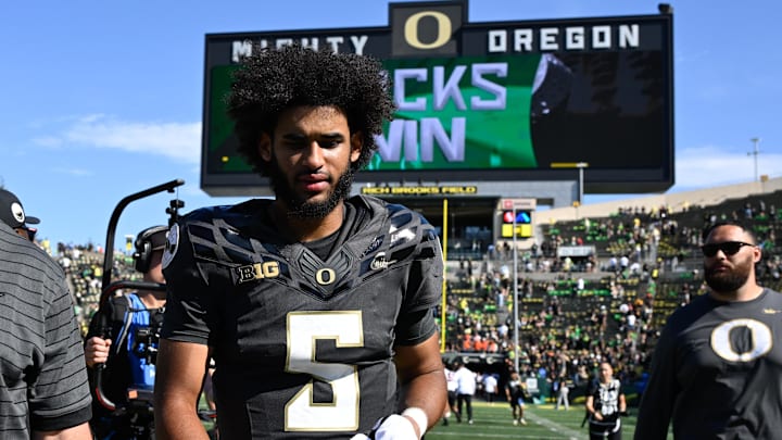 Sep 20, 2025; Eugene, Oregon, USA; Oregon Ducks quarterback Dante Moore (5) walks off the field after the game against the Oregon State Beavers at Autzen Stadium. Mandatory Credit: Troy Wayrynen-Imagn Images