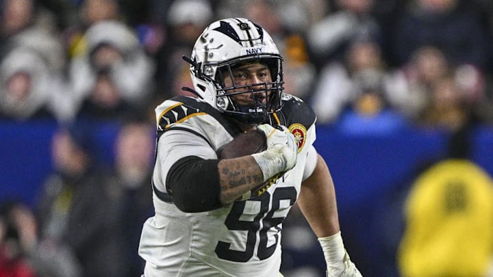 Dec 14, 2024; Landover, Maryland, USA; Navy Midshipmen defensive tackle Landon Robinson (96) runs on na fake punt during the second half against the Army Black Knights at Commanders Field. Mandatory Credit: Tommy Gilligan-Imagn Images Dec 14, 2024; Landover, Maryland, USA; Navy Midshipmen defensive tackle Landon Robinson (96) runs on na fake punt during the second half against the Army Black Knights at Commanders Field. Mandatory Credit: Tommy Gilligan-Imagn Images