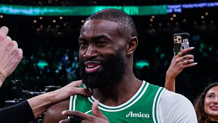 Mar 18, 2026; Boston, Massachusetts, USA; Boston Celtics guard Jaylen Brown (7) talks with Golden State Warriors center Kristaps Porzingis (7) after the game at TD Garden. Mandatory Credit: David Butler II-Imagn Images