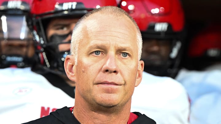 Sep 11, 2025; Winston-Salem, North Carolina, USA;  North Carolina State Wolfpack head coach Dave Doeren walks his team out on the field against the Wake Forest Demon Deacons at Allegacy Federal Credit Union Stadium. Mandatory Credit: Luke Jamroz-Imagn Images