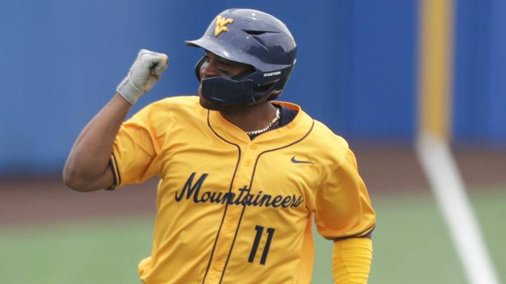 West Virginia Mountaineers graduate Sean Smith (11) pumps his first after hitting a home run against Kansas Jayhawks during the game inside Hoglund Ballpark on May 10, 2026.
