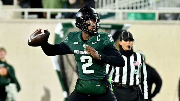 Nov 22, 2024; East Lansing, Michigan, USA;  Michigan State Spartans quarterback Aidan Chiles (2) throws upfield against the Purdue Boilermakers during the second quarter at Spartan Stadium. Mandatory Credit: Dale Young-Imagn Images