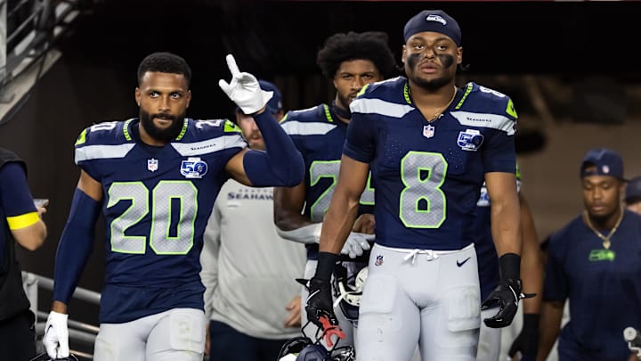Sep 25, 2025; Glendale, Arizona, USA; Seattle Seahawks safety Julian Love (20) and Coby Bryant (8) against the Arizona Cardinals at State Farm Stadium. Mandatory Credit: Mark J. Rebilas-Imagn Images