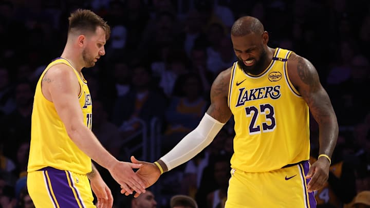 Feb 27, 2025; Los Angeles, California, USA; Los Angeles Lakers guard Luka Doncic (77) and forward LeBron James (23) celebrate after a play during the fourth quarter against the Minnesota Timberwolves at Crypto.com Arena. Mandatory Credit: Jason Parkhurst-Imagn Images Feb 27, 2025; Los Angeles, California, USA; Los Angeles Lakers guard Luka Doncic (77) and forward LeBron James (23) celebrate after a play during the fourth quarter against the Minnesota Timberwolves at Crypto.com Arena. Mandatory Credit: Jason Parkhurst-Imagn Images