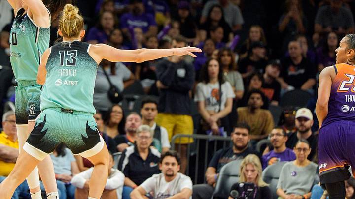 Sep 14, 2025; Phoenix, Arizona, USA; New York Liberty forward Breanna Stewart (30) and forward Leonie Fiebich (13) double team Phoenix Mercury forward Satou Sabally (0) in overtime during game one of the 2025 WNBA Playoffs round one at PHX Arena. Mandatory Credit: Allan Henry-Imagn Images