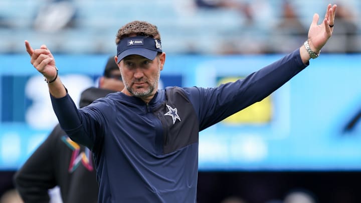 Dallas Cowboys head coach Brian Schottenheimer reacts during warm-ups prior to the game against the Carolina Panthers at Bank of America Stadium.