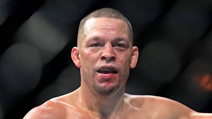 Nate Diaz (red gloves) fights Tony Ferguson (blue gloves) Nate Diaz (red gloves) fights Tony Ferguson (blue gloves)