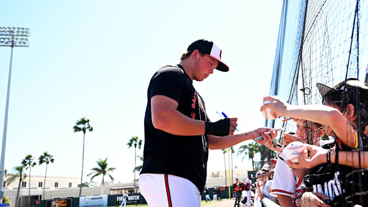 Feb 20, 2026; Sarasota, Florida, USA; Baltimore Orioles infielder Jackson Holliday (7) signs autographs before the start of the spring training game against the  New York Yankees at Ed Smith Stadium. Mandatory Credit: Jonathan Dyer-Imagn Images