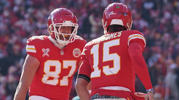 Dec 21, 2024; Kansas City, Missouri, USA; Kansas City Chiefs tight end Travis Kelce (87) celebrates with quarterback Patrick Mahomes (15) after Mahomes’ touchdown against the Houston Texans during the first half at GEHA Field at Arrowhead Stadium. Mandatory Credit: Denny Medley-Imagn Images