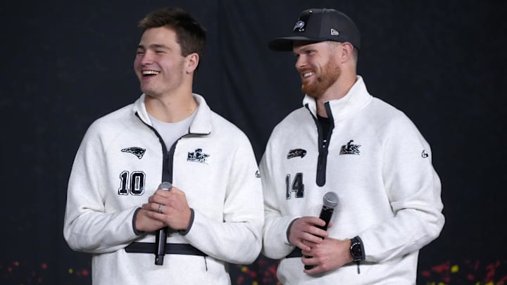 Feb 2, 2026; San Jose, CA, USA; Seattle Seahawks quarterback Sam Darnold (14) and New England Patriots quarterback Drake Maye (10) during Opening Night for Super Bowl LX at San Jose Convention Center.
