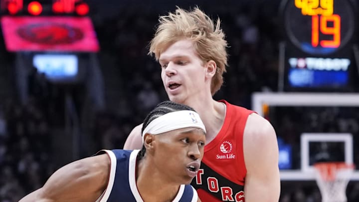 Denver Nuggets guard Peyton Watson dribbles against Toronto Raptors guard/forward Gradey Dick. Denver Nuggets guard Peyton Watson dribbles against Toronto Raptors guard/forward Gradey Dick.