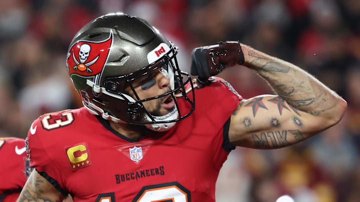 Jan 12, 2025; Tampa, Florida, USA; Tampa Bay Buccaneers wide receiver Mike Evans (13) celebrates after a touchdown catch with tight end Cade Otton (88) during the second quarter of a NFC wild card playoff against the Washington Commanders at Raymond James Stadium. Mandatory Credit: Kim Klement Neitzel-Imagn Images Jan 12, 2025; Tampa, Florida, USA; Tampa Bay Buccaneers wide receiver Mike Evans (13) celebrates after a touchdown catch with tight end Cade Otton (88) during the second quarter of a NFC wild card playoff against the Washington Commanders at Raymond James Stadium. Mandatory Credit: Kim Klement Neitzel-Imagn Images