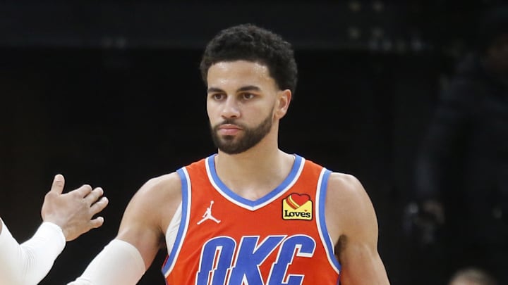 Jan 9, 2026; Memphis, Tennessee, USA; Oklahoma City Thunder guard Ajay Mitchell (25) reacts with guard Aaron Wiggins (21) during the fourth quarter against the Memphis Grizzlies at FedExForum. Mandatory Credit: Petre Thomas-Imagn Images