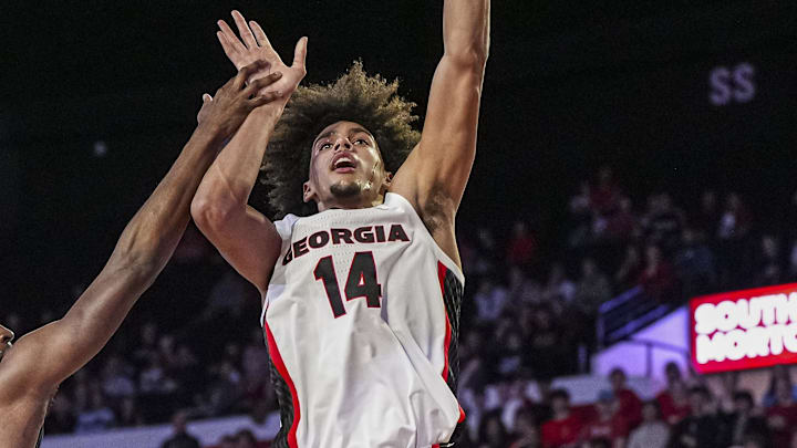 Nov 4, 2024; Athens, Georgia, USA; Georgia Bulldogs forward Asa Newell (14) shoots over Tennessee Tech Golden Eagles forward Ola Ajiboye (8) at Stegeman Coliseum. Mandatory Credit: Dale Zanine-Imagn Images