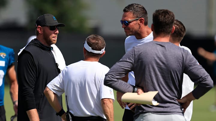 Jacksonville Jaguars head coach Liam Coen, center left in black, talks after an NFL training camp session at the Miller Electric Center, Friday, July 25, 2025, in Jacksonville, Fla. [Corey Perrine/Florida Times-Union]