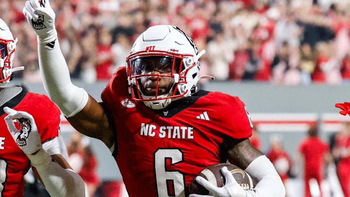 Nov 21, 2025; Raleigh, North Carolina, USA; NC State Wolfpack defensive back Devon Marshall (6) celebrates a down and runs towards the JROTC to celebrate during the first half of the game against Florida State Seminoles at Carter-Finley Stadium. Mandatory Credit: Jaylynn Nash-Imagn Images Nov 21, 2025; Raleigh, North Carolina, USA; NC State Wolfpack defensive back Devon Marshall (6) celebrates a down and runs towards the JROTC to celebrate during the first half of the game against Florida State Seminoles at Carter-Finley Stadium. Mandatory Credit: Jaylynn Nash-Imagn Images