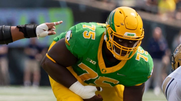 Oregon offensive linemen Iapani Laloulu, left, and Emmanuel Pregnon line up as the Oregon Ducks host the Montana State Bobcats on Aug. 30, 2025, at Autzen Stadium in Eugene, Oregon.