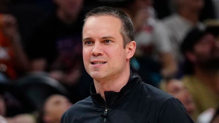 Suns head coach Jordan Ott talks with a referee during a game at Mortgage Matchup Center in Phoenix, Ariz. on Feb. 7, 2026.