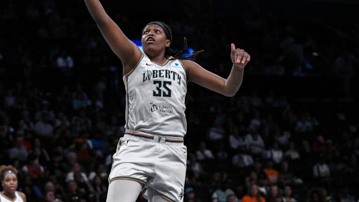 Aug 25, 2025; Brooklyn, New York, USA; New York Liberty center Jonquel Jones (35) drives to the basket against the Connecticut Sun during the first half at Barclays Center. Mandatory Credit: John Jones-Imagn Images