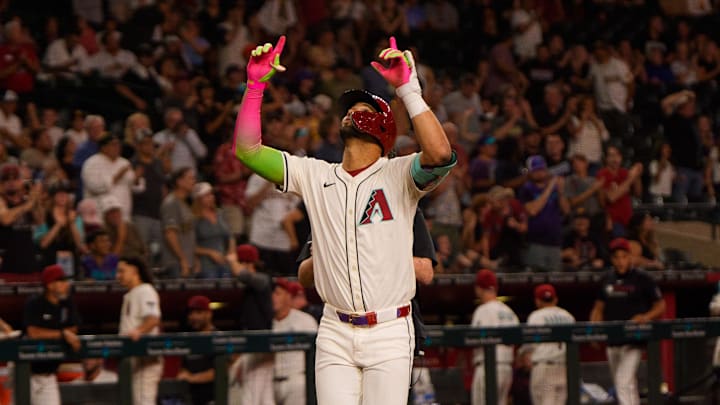 Aug 5, 2025; Phoenix, Arizona, USA; Arizona Diamondbacks outfielder Lourdes Gurriel Jr. (12) reacts after hitting a home run in the eighth inning to tie the game against the San Diego Padres at Chase Field. Mandatory Credit: Allan Henry-Imagn Images