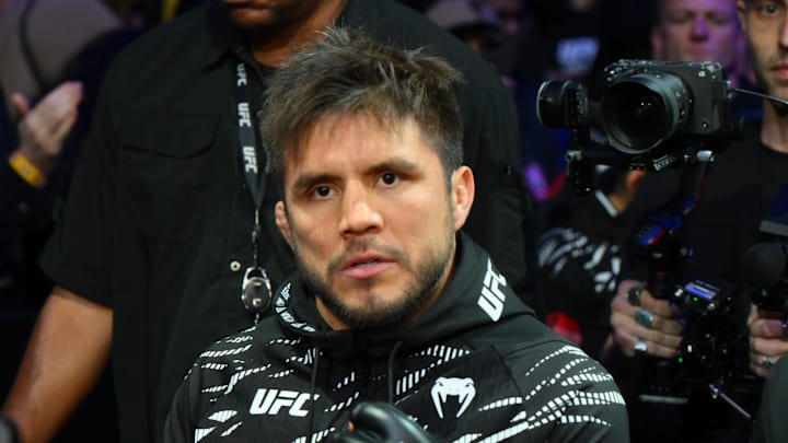 Feb 22, 2025; Seattle, Washington, USA; Henry Cejudo (red gloves) is introduced prior to fighting Song Yadong (blue gloves) in the bantamweight bout during UFC Fight Night at Climate Pledge Arena. Mandatory Credit: Steven Bisig-Imagn Images Feb 22, 2025; Seattle, Washington, USA; Henry Cejudo (red gloves) is introduced prior to fighting Song Yadong (blue gloves) in the bantamweight bout during UFC Fight Night at Climate Pledge Arena. Mandatory Credit: Steven Bisig-Imagn Images