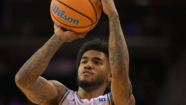 Feb 7, 2026; Los Angeles, California, USA;  UCLA Bruins guard Donovan Dent (2) shoots the ball in the first half against the Washington Huskies at Pauley Pavilion presented by Wescom Financial. Mandatory Credit: Jayne Kamin-Oncea-Imagn Images