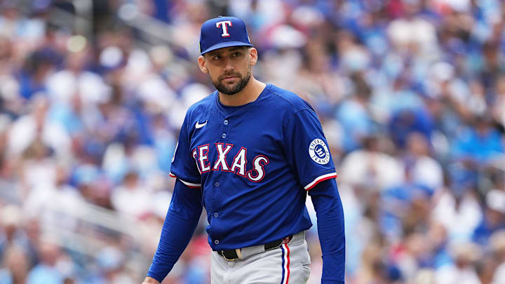 Texas Rangers starting pitcher Nathan Eovaldi walks off the field.