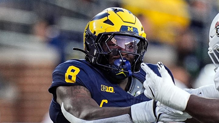 Michigan edge Derrick Moore (8) goes against New Mexico offensive lineman Malik Aliane (51) during the first half at Michigan Stadium in Ann Arbor on Saturday, August 30, 2025.