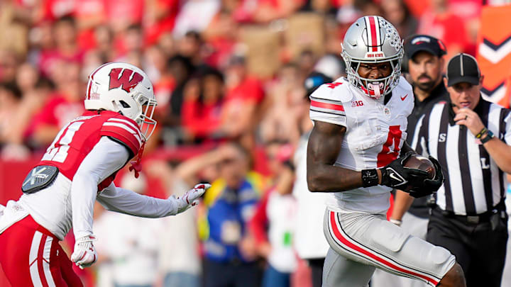 Ohio State Buckeyes wide receiver Jeremiah Smith (4) runs the ball during the game against the Wisconsin Badgers at Camp Randall Stadium on Saturday, Oct. 18, 2025 in Madison, Wisconsin. Ohio State Buckeyes wide receiver Jeremiah Smith (4) runs the ball during the game against the Wisconsin Badgers at Camp Randall Stadium on Saturday, Oct. 18, 2025 in Madison, Wisconsin.