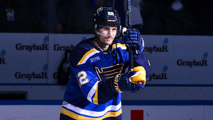 Nov 3, 2025; St. Louis, Missouri, USA; St. Louis Blues center Pius Suter (22) salutes the fans after he was named second star of the game in a victory over the Edmonton Oilers at Enterprise Center. Mandatory Credit: Jeff Curry-Imagn Images